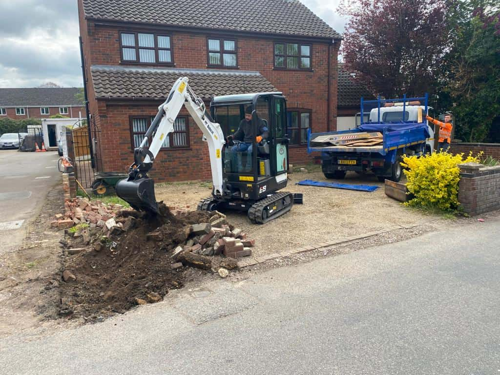 This is a photo of an operative of Felixstowe Driveway Services Digging out for a new tarmac driveway